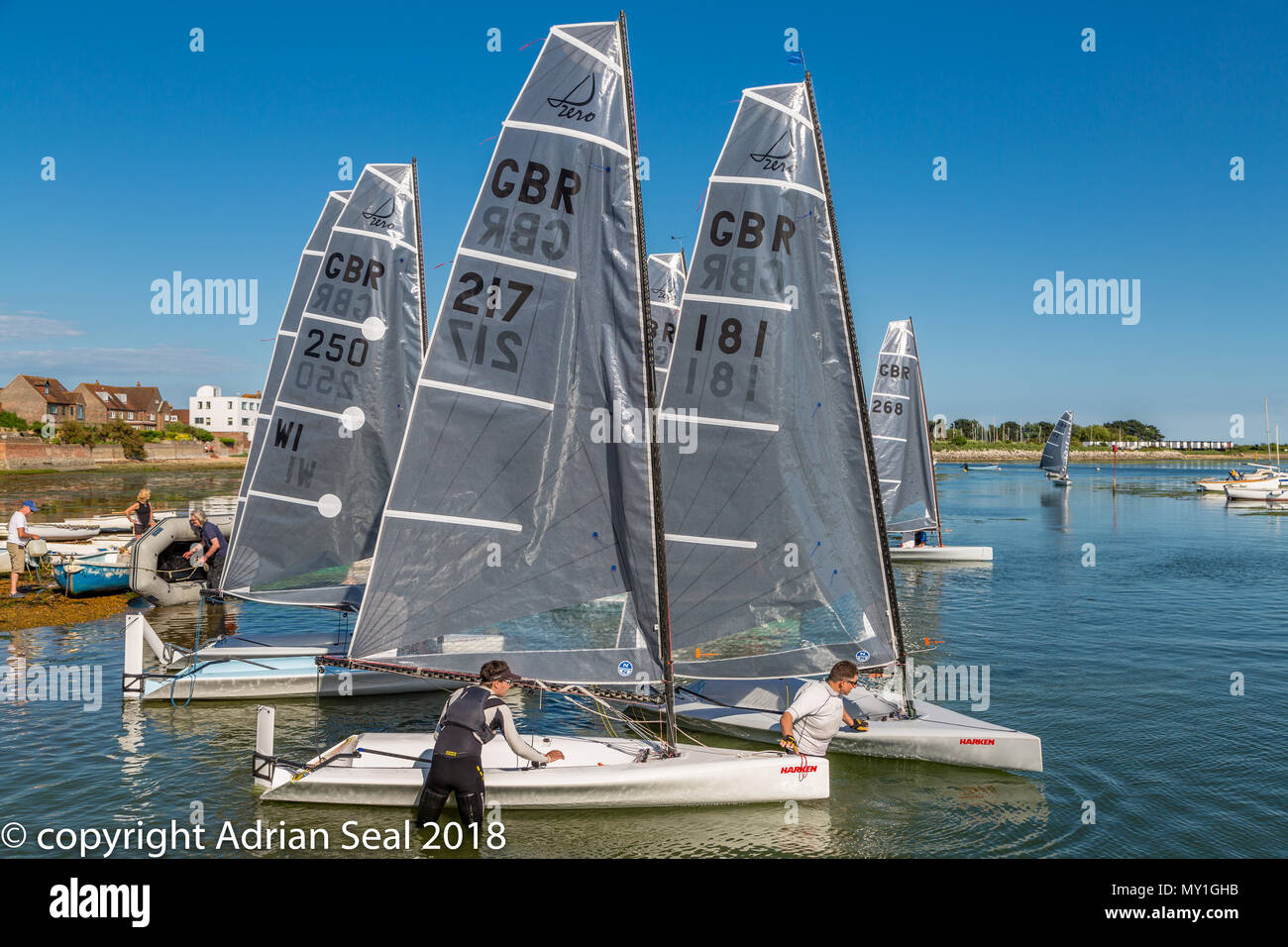 Single seater racing yachts in the basin at Emsworth a small and picturesque town toward the northern end of Chichester harbour, Hampshire, England UK Stock Photo