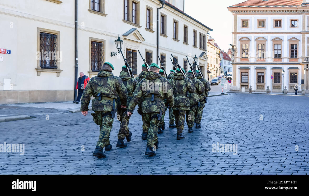 Soldiers are marching at the Prague streets after Changing the Guard ceremony in Prague Castle. Stock Photo