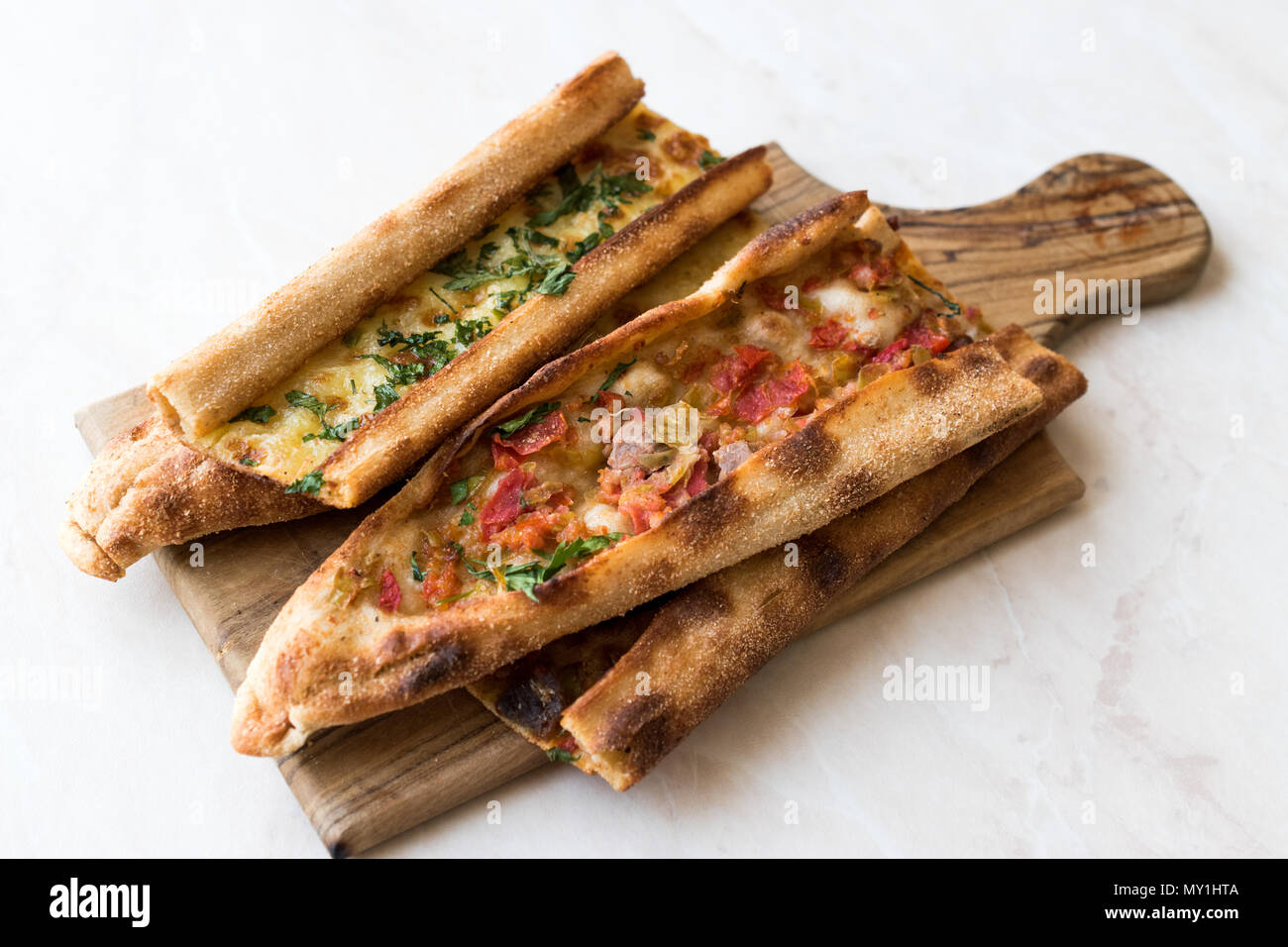 Turkish Pastry Konya Mevlana Pide with Cubed Meat and Melted Cheese. Traditional Food. Stock Photo