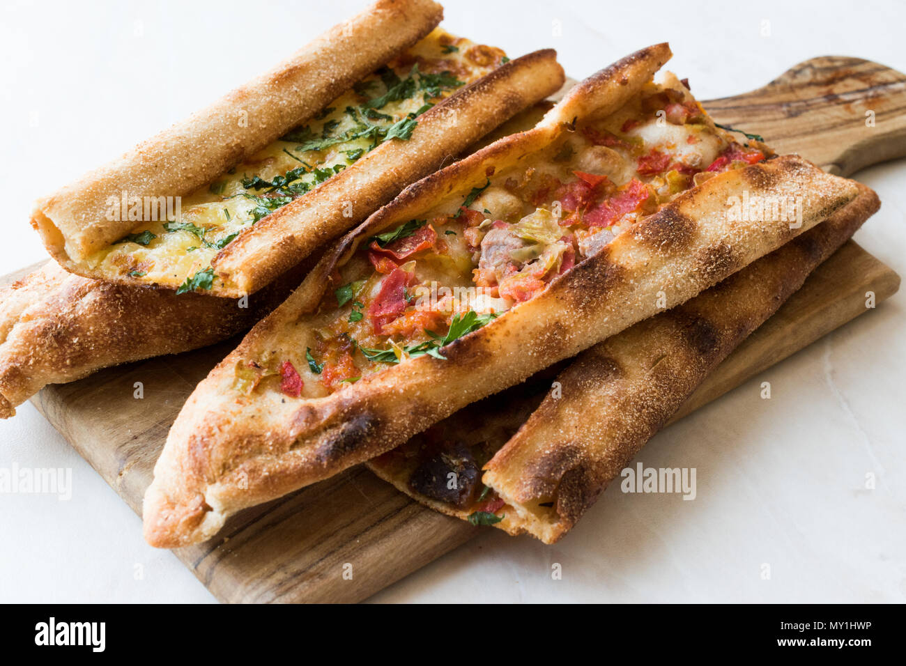 Turkish Pastry Konya Mevlana Pide with Cubed Meat and Melted Cheese. Traditional Food. Stock Photo