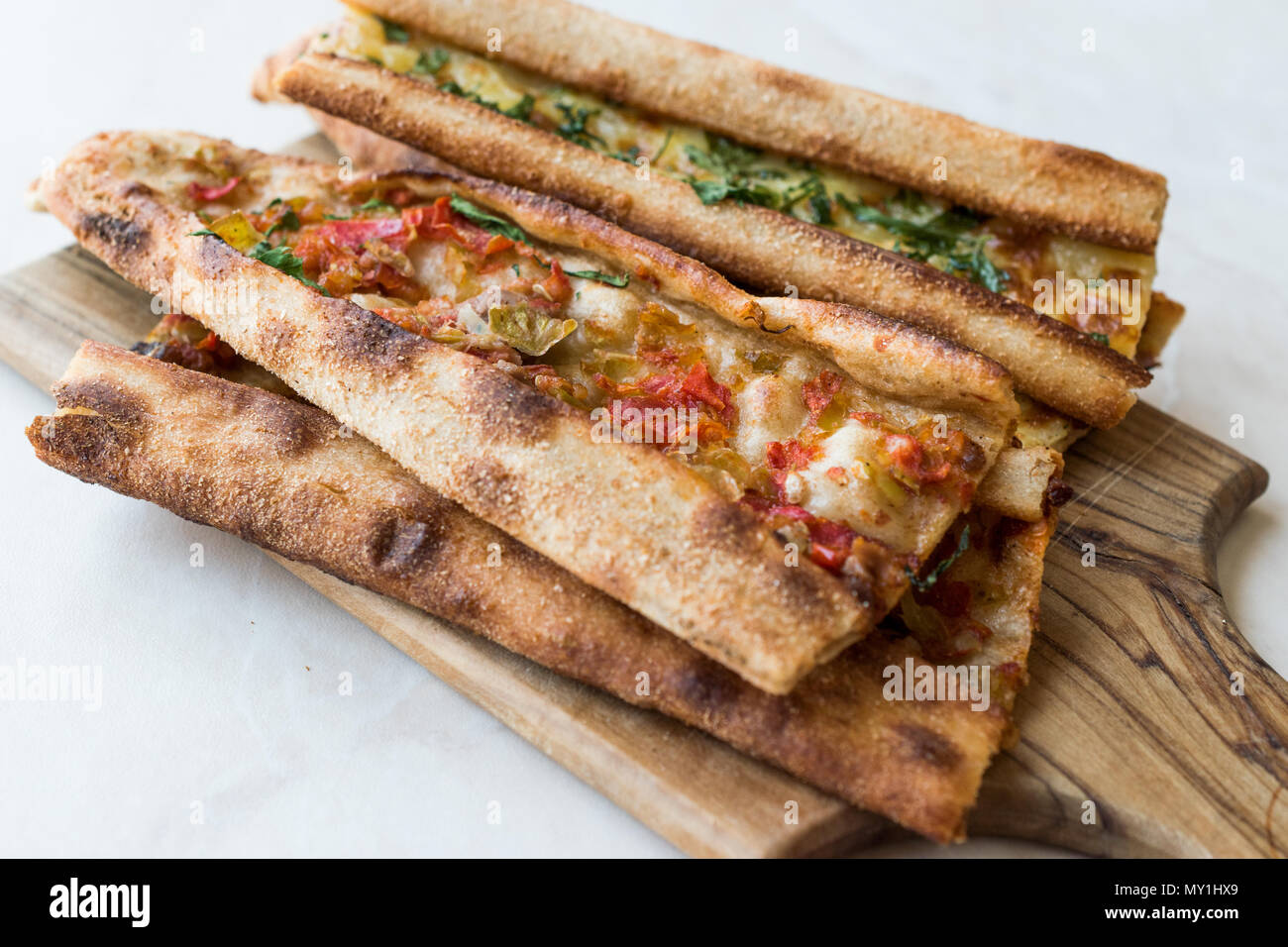 Turkish Pastry Konya Mevlana Pide with Cubed Meat and Melted Cheese. Traditional Food. Stock Photo