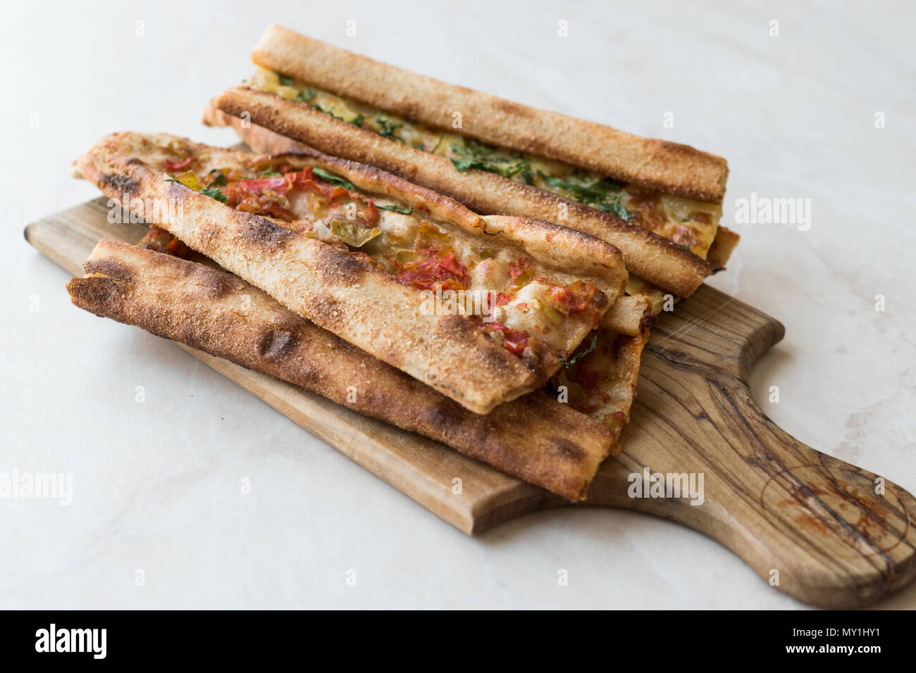 Turkish Pastry Konya Mevlana Pide with Cubed Meat and Melted Cheese. Traditional Food. Stock Photo