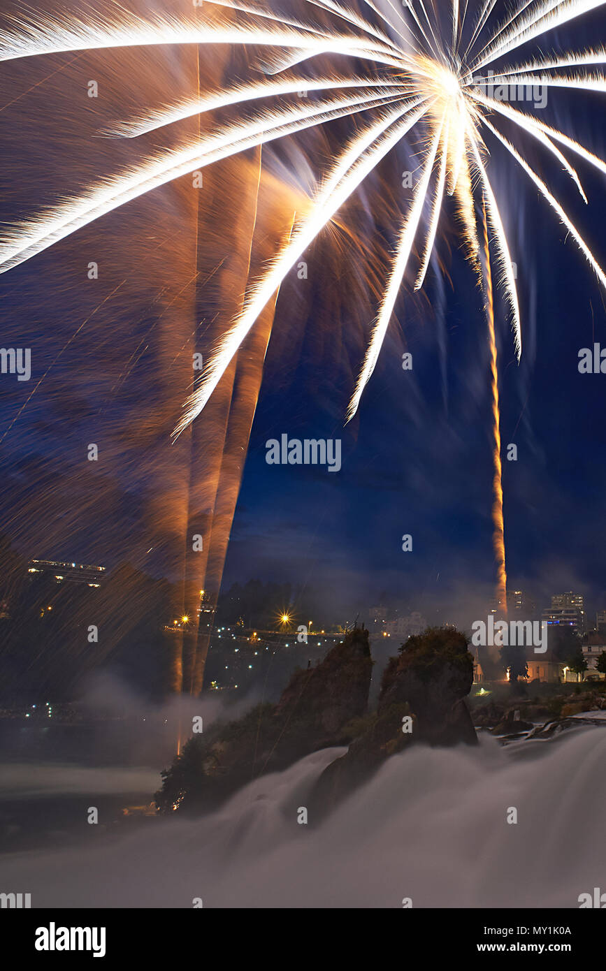 Amazing fireworks display in Schaffhausen where the river Rheine has its origin during Swiss national day Stock Photo
