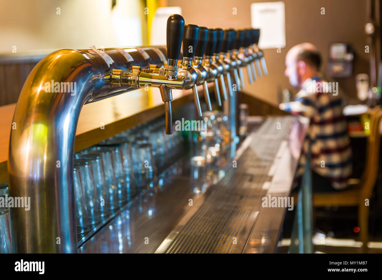 Beer taps on bar counter, brewpub. Craft beer Stock Photo Alamy