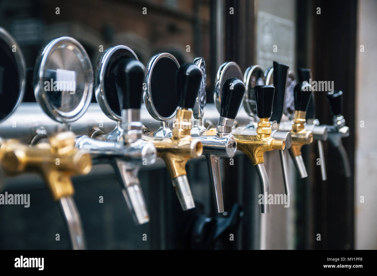 Beer tap in a row with free space for logos Stock Photo