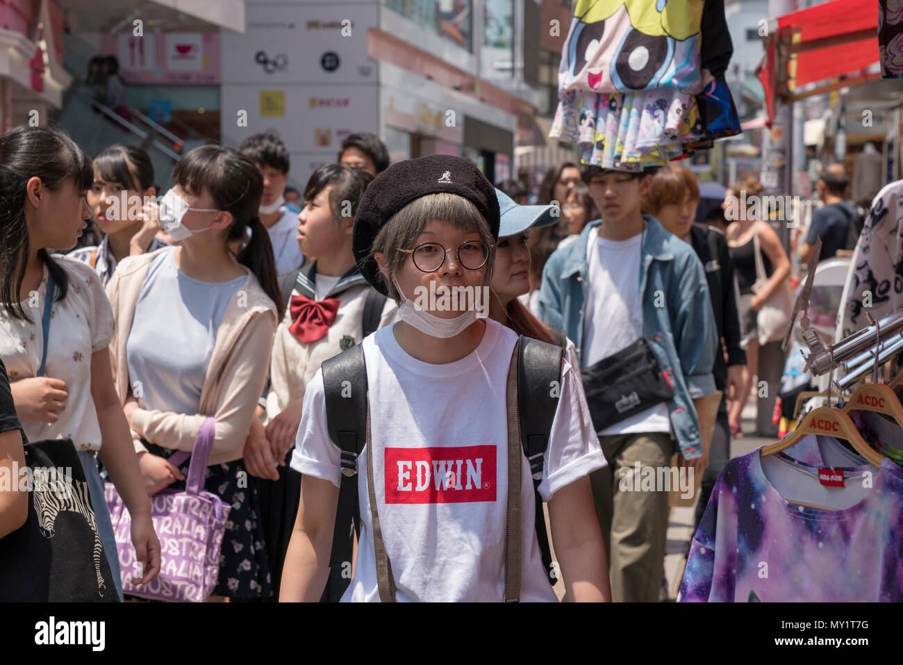 Crowds of people in Takeshita Street, a pedestrian shopping street lined with fashion boutiques, cafes and restaurants in Harajuku in Tokyo, Japan Stock Photo