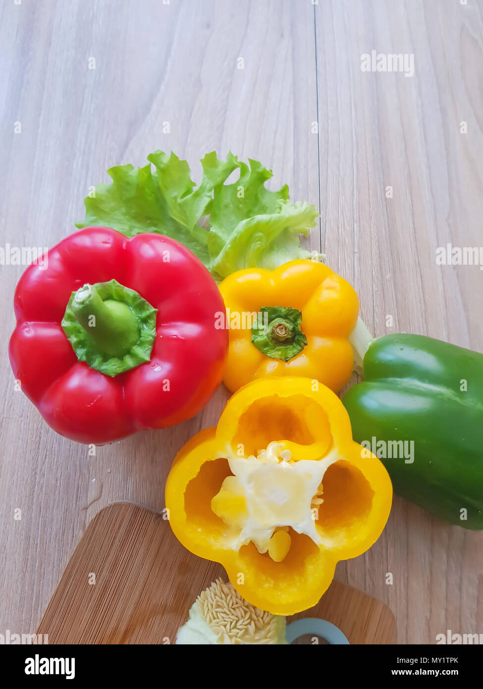 Fresh bell pepper on wood table top view background Stock Photo - Alamy