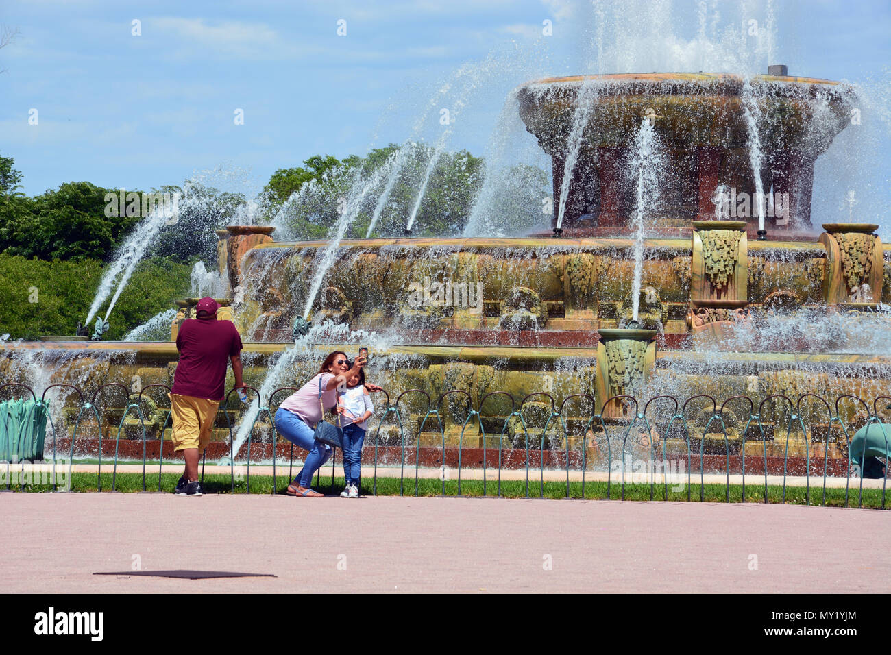 A mother and daughter take a selfie at Buckingham Fountain, the centerpiece to Chicago's South Loop's Grant Park. Stock Photo
