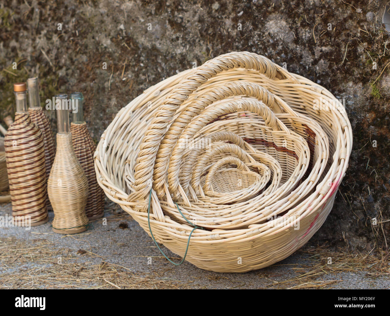 Empty hand made wicker basket with different sizes in  the background. Stock Photo