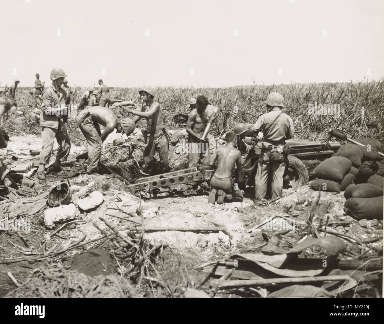 4th division marines on Tinian set up their 75 mm howitzers guns near beach Stock Photo