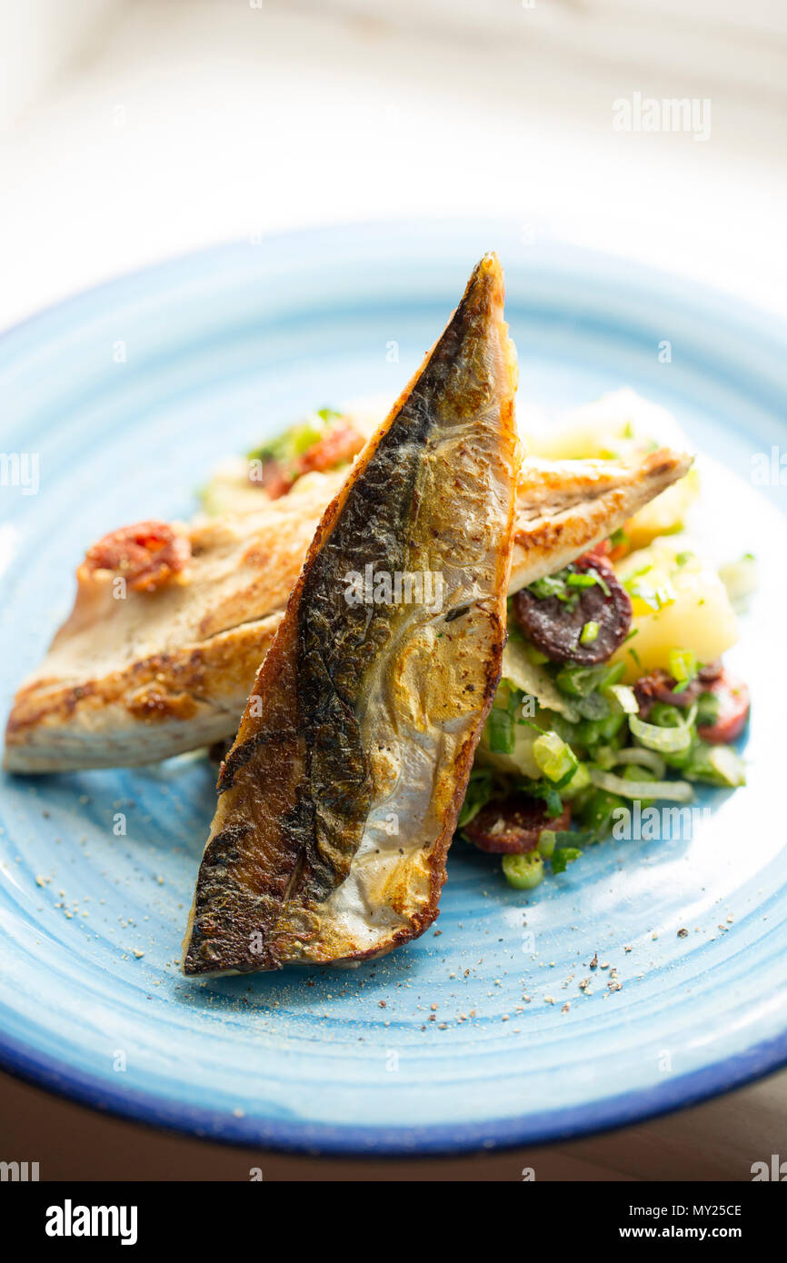 Mackerel recipe from mackerel caught from Chesil beach in Dorset on rod and line. This is a Jamie Oliver recipe with fried mackerel fillets served wit Stock Photo