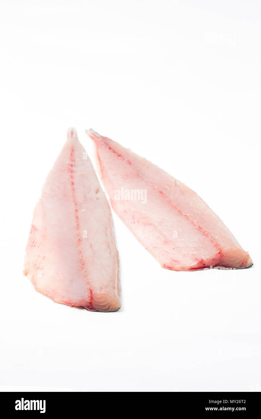 A pair of fresh, raw mackerel fillets on a white background from a mackerel caught from Chesil beach in Dorset on rod and line. Dorset England UK GB Stock Photo