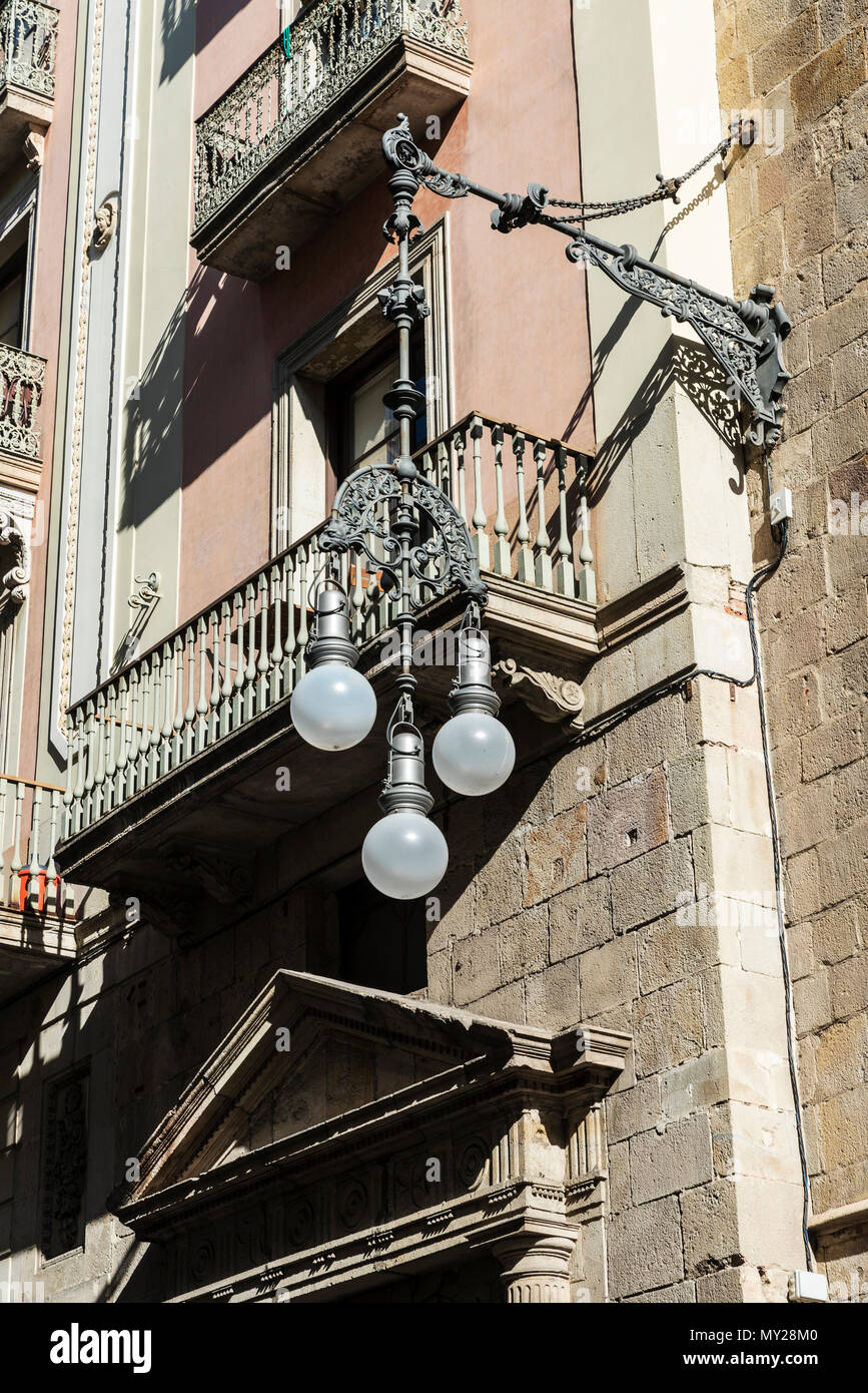 Retro black classic lamppost of wrought iron with three circular lights balloons in Barcelona, Catalonia, Spain Stock Photo