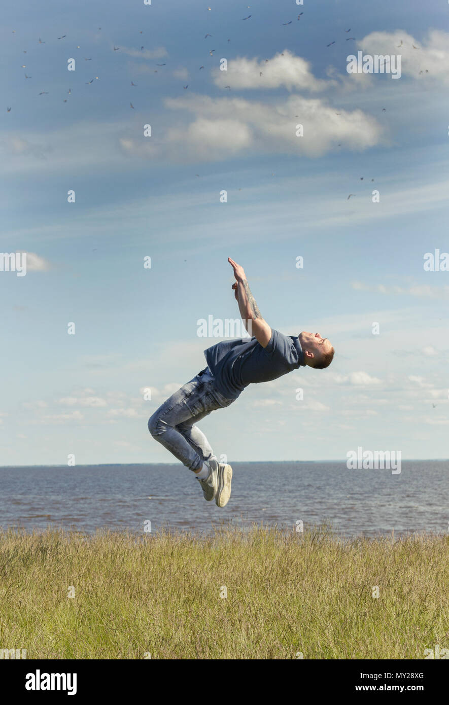 Man flipping over grass hi-res stock photography and images - Alamy