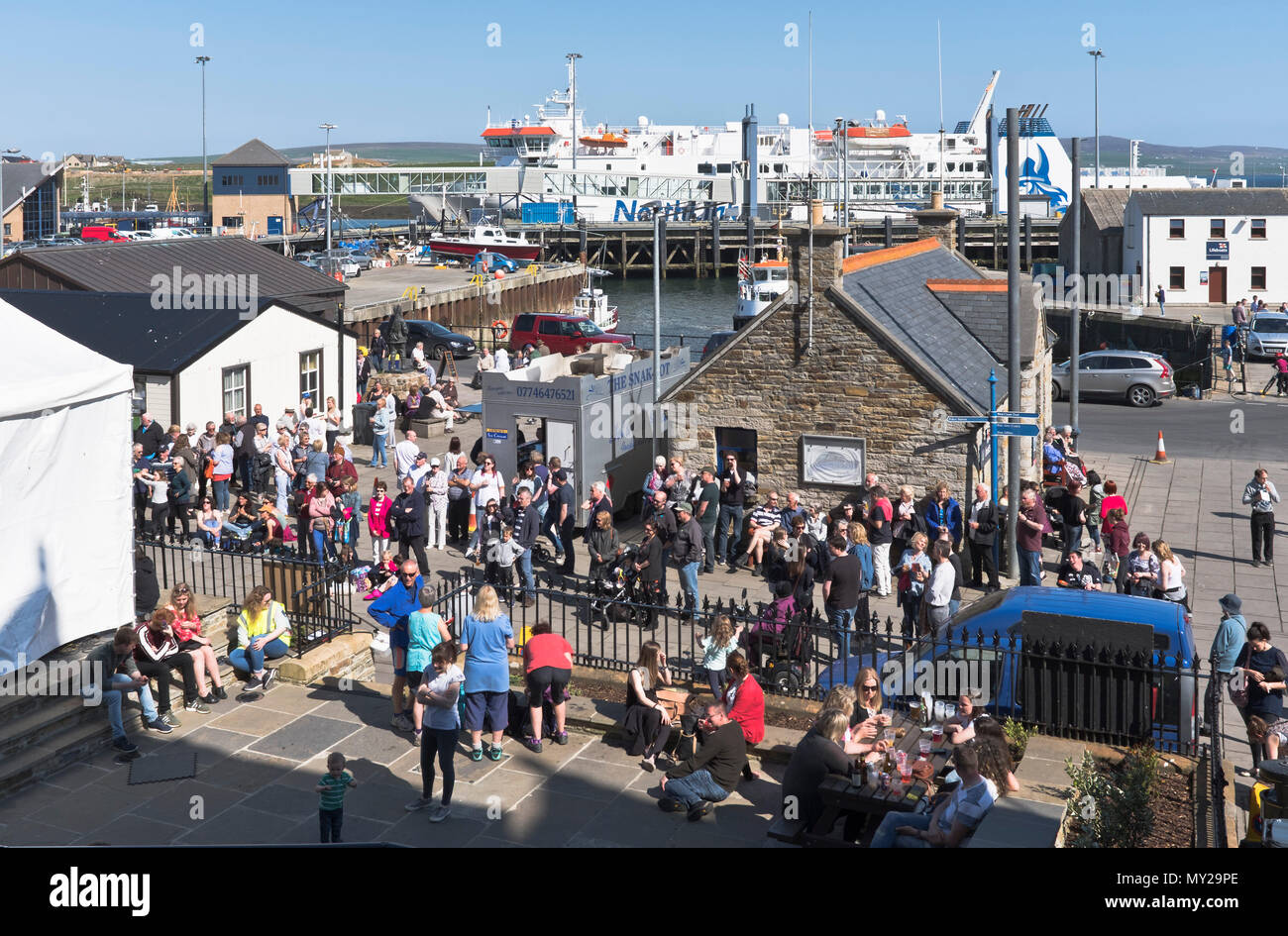 dh Stromness Folk Festival STROMNESS ORKNEY Crowd of people Stromness street listening to music festivals Stock Photo