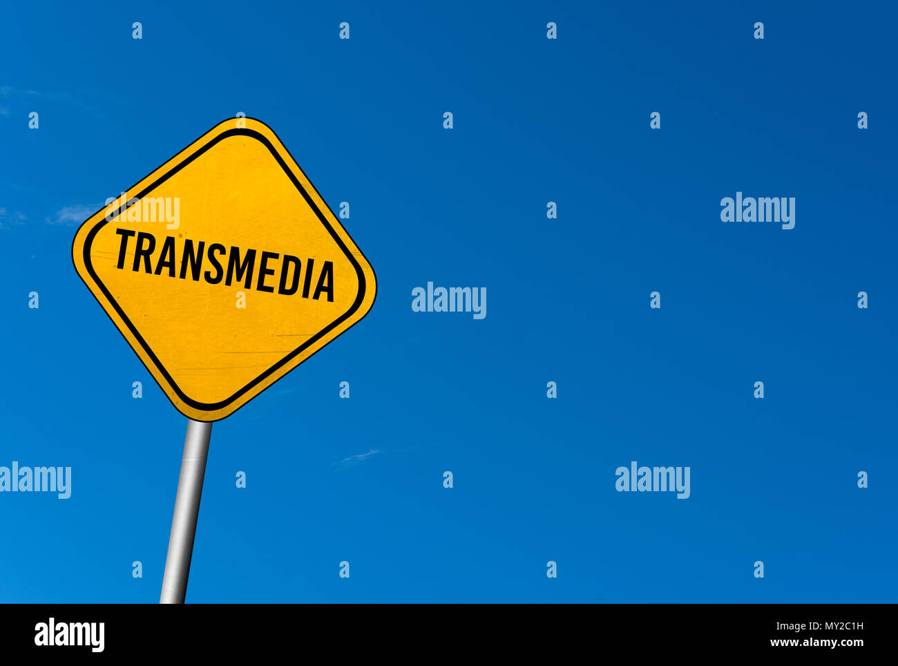 Transmedia - yellow sign with blue sky Stock Photo