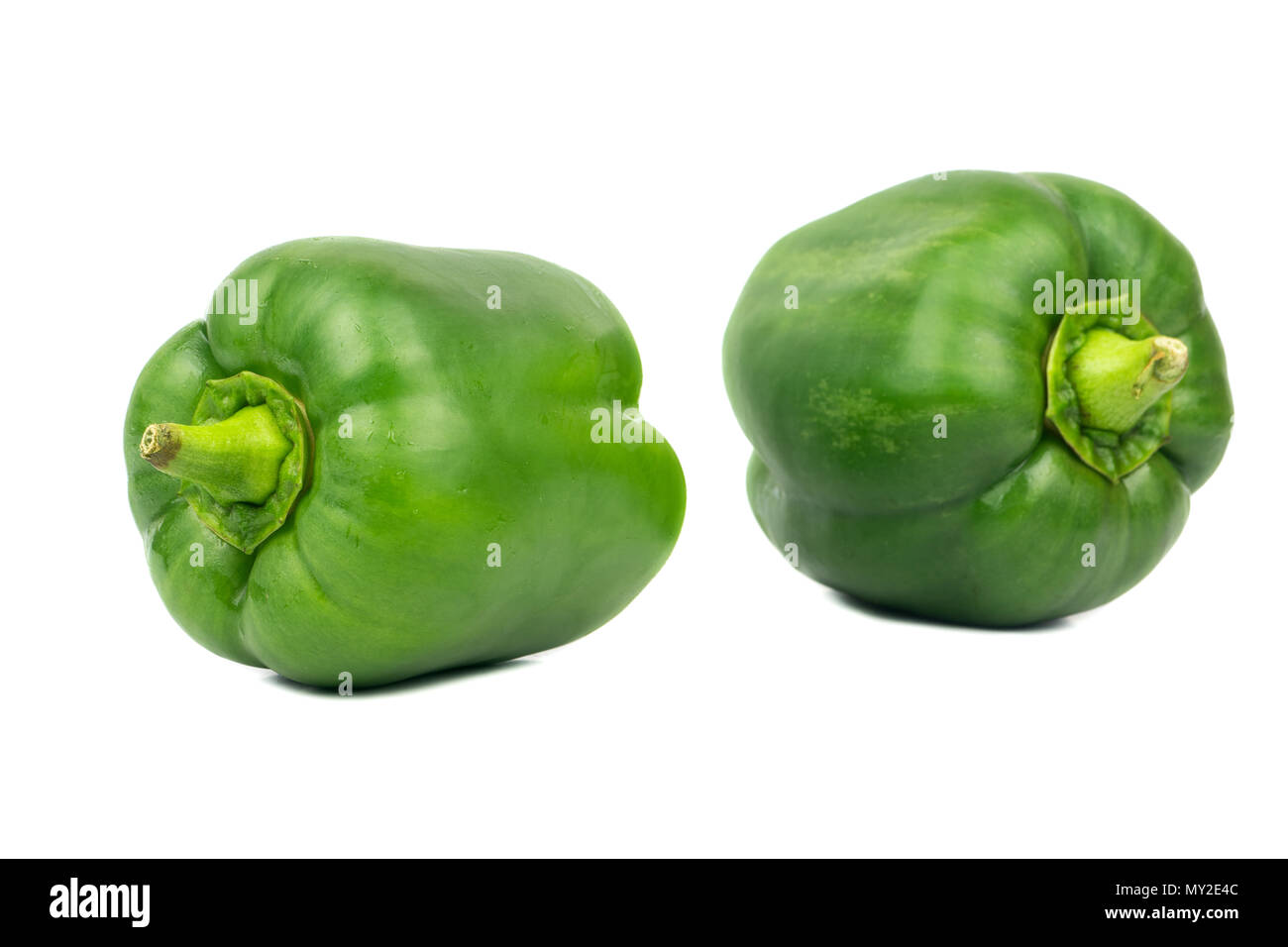Two green peppers isolated on white background Stock Photo - Alamy