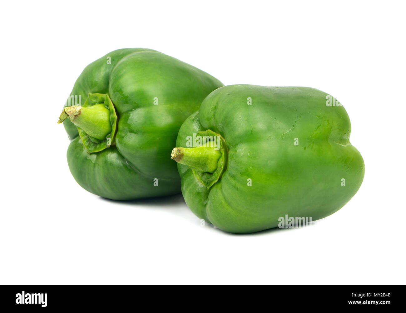 Two green peppers isolated on white background Stock Photo - Alamy