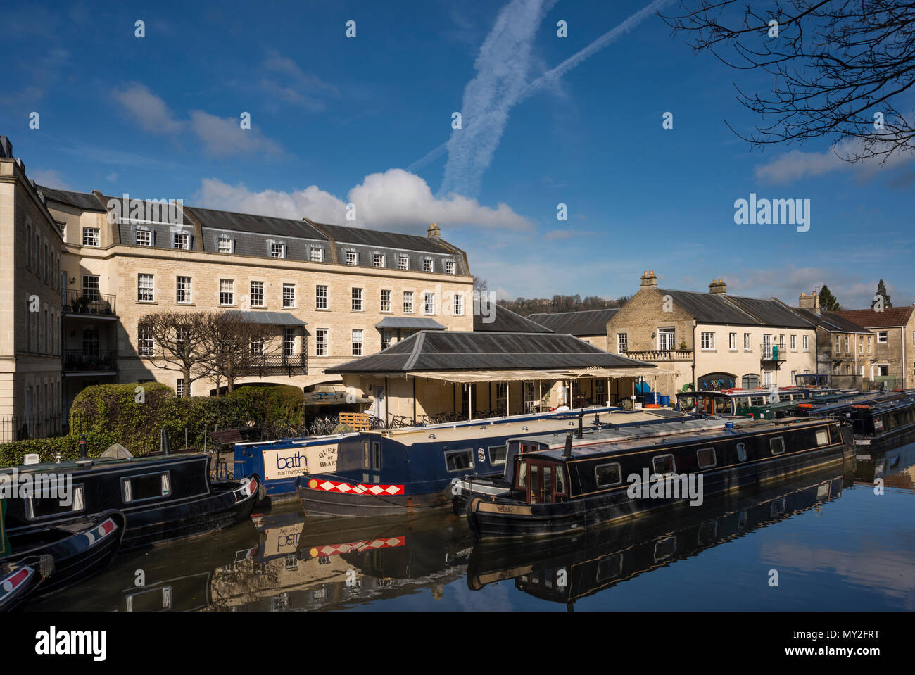 Narrow canal boats moored at Sydney Wharf, Kennet and Avon Canal, Bath, Somerset, UK Stock Photo