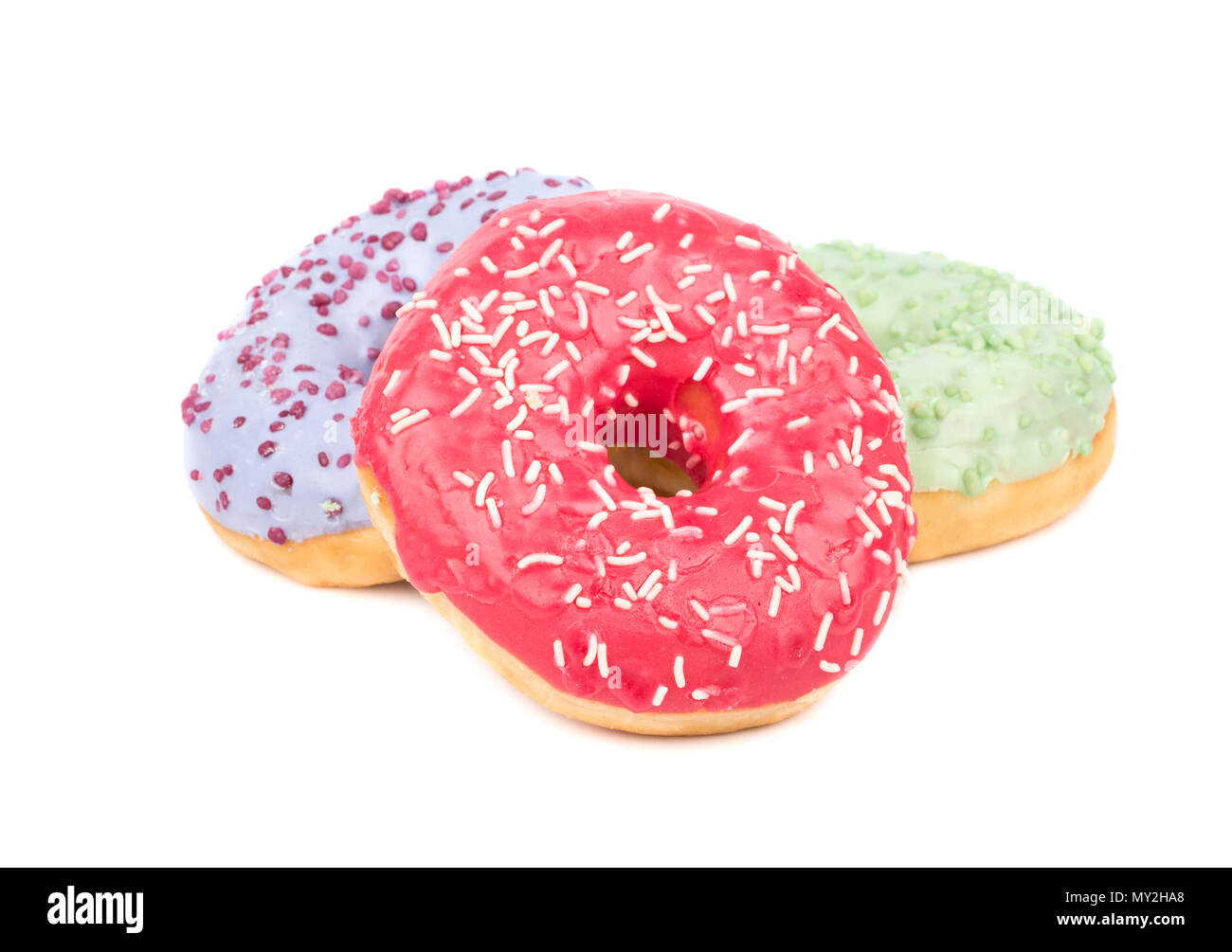 Three tasty colored donuts on a white background Stock Photo - Alamy