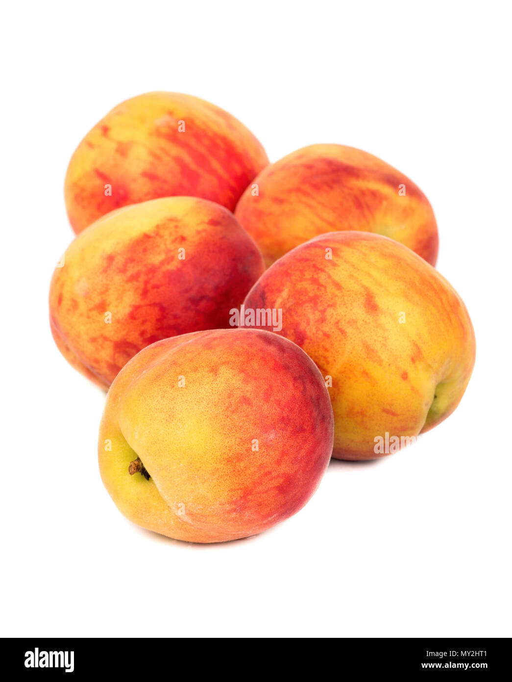 Several ripe peaches on a white background Stock Photo