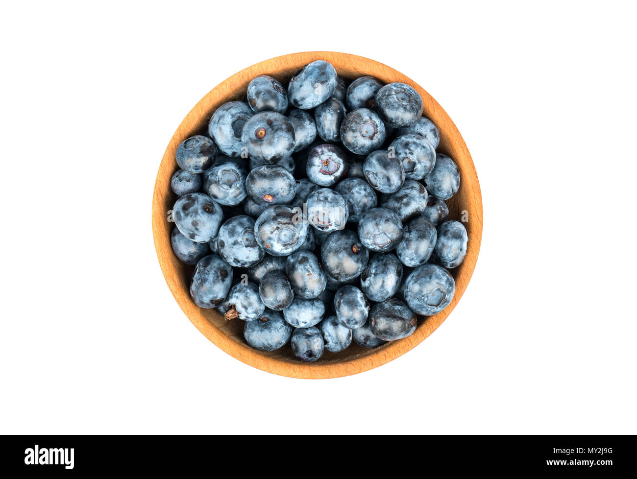 Fresh blueberries in a wooden bowl isolated on white background, top view Stock Photo
