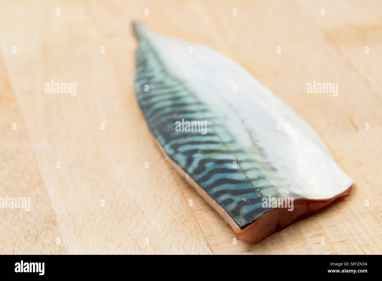 A single raw mackerel fillet, skin side uppermost