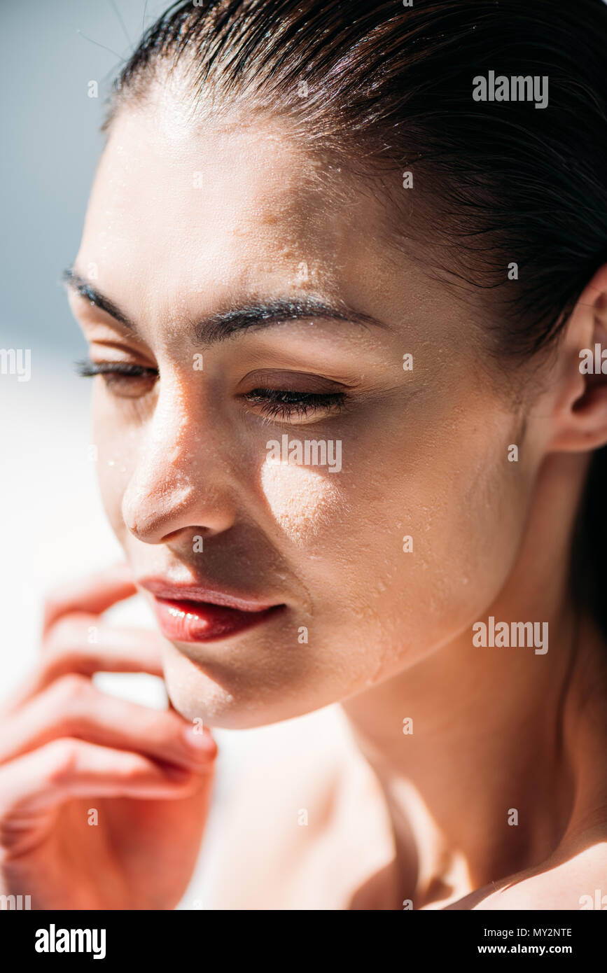 Portrait Shot Of Young Attractive Woman With Water Droplets On