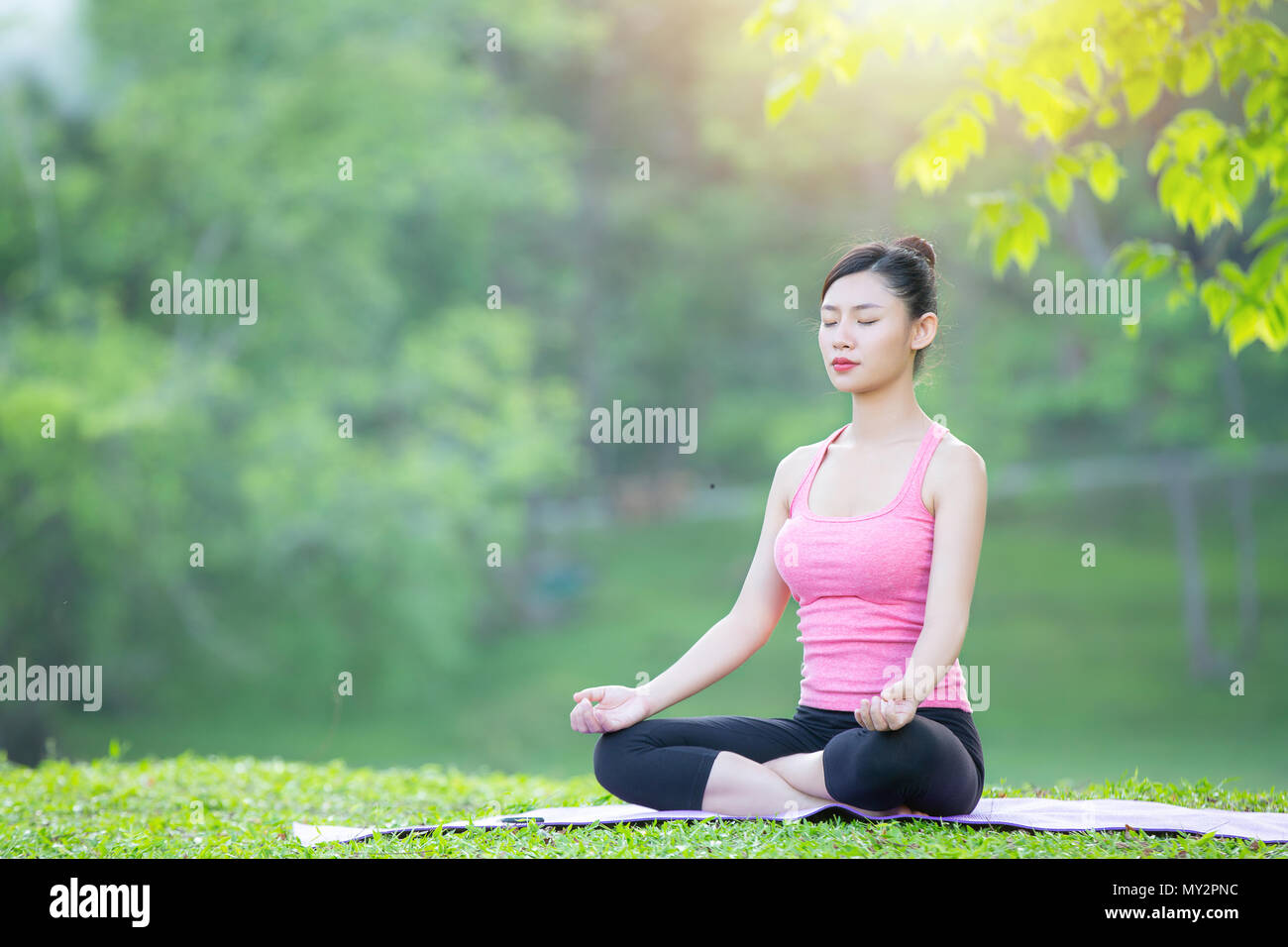 Yoga lady practicing in park outdoor, Meditation, Exercise. Stock Photo
