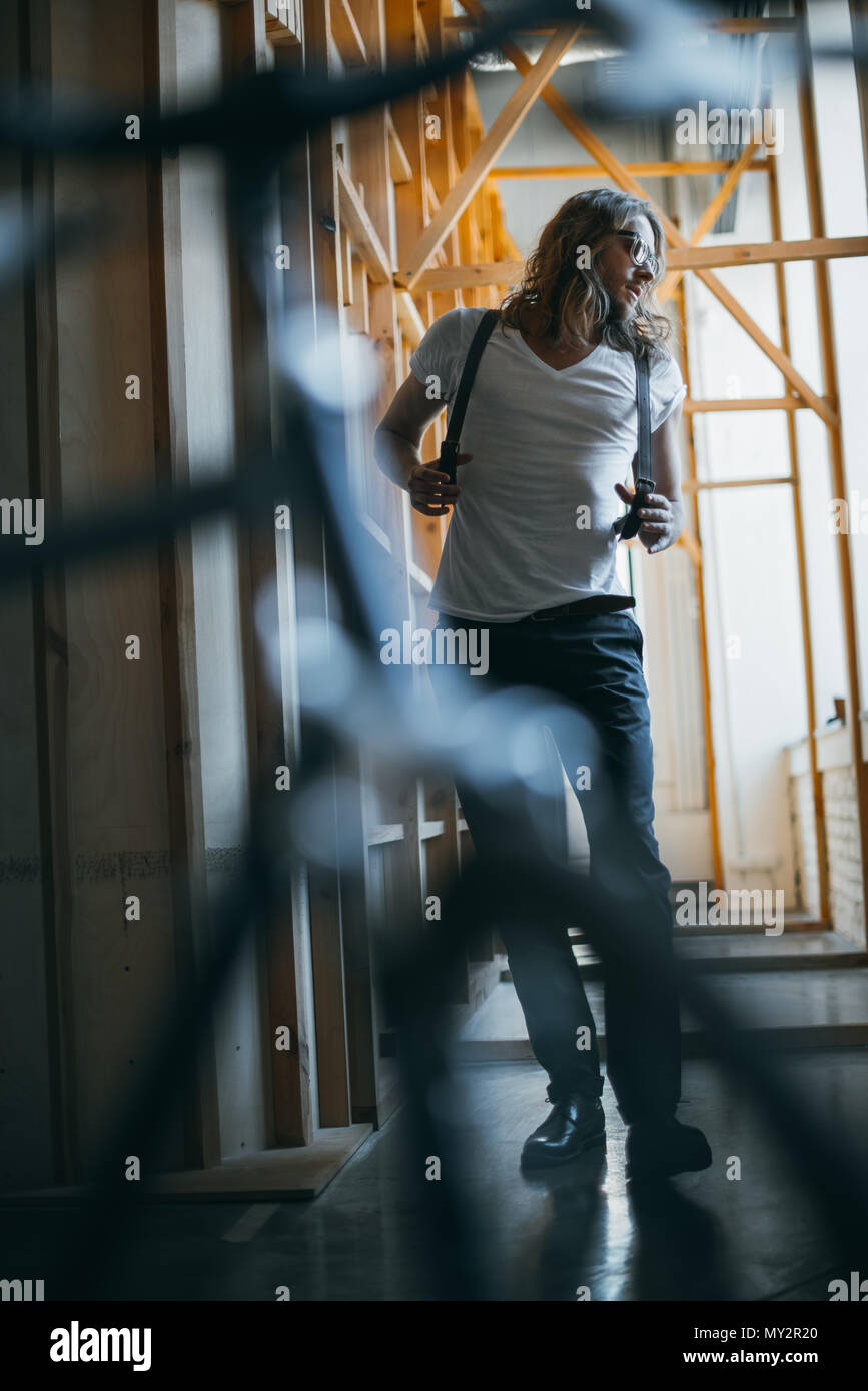 Long haired man walking away hi-res stock photography and images - Alamy