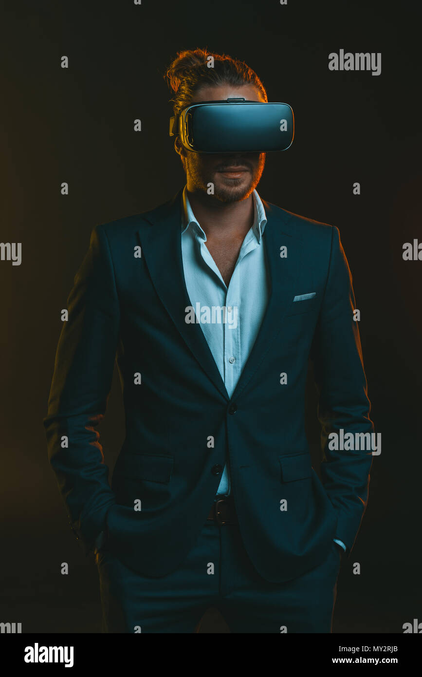 elegant man in suit using virtual reality headset Stock Photo - Alamy