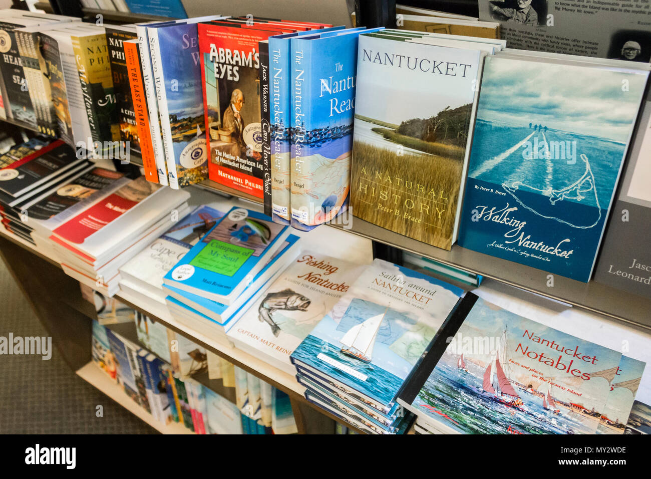 Books about Nantucket island in a shelf inside Mitchell's Book Corner, a bookshop in Nantucket town, Massachusetts Stock Photo