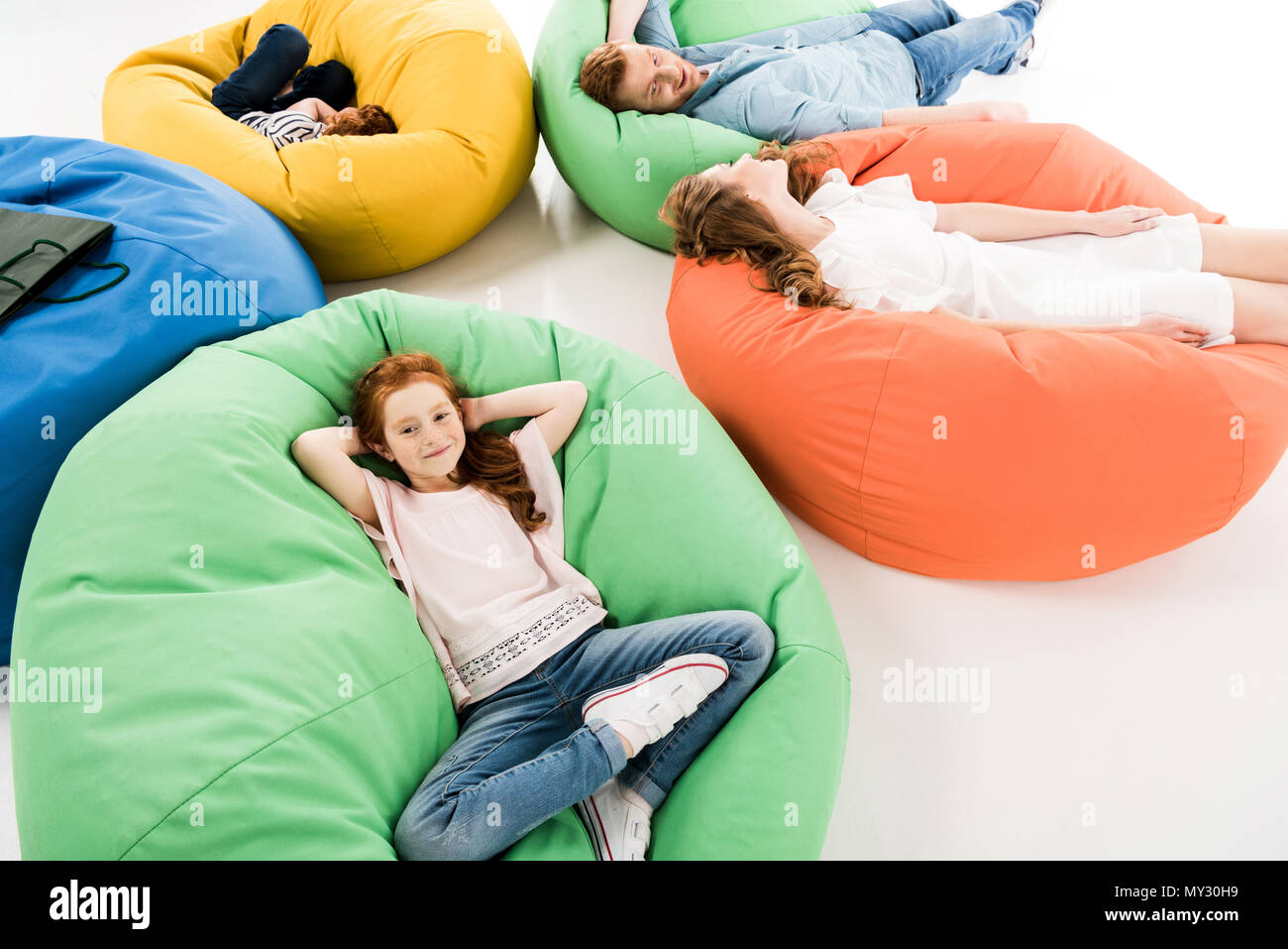 Girl lying on bean bag hi-res stock photography and images - Alamy