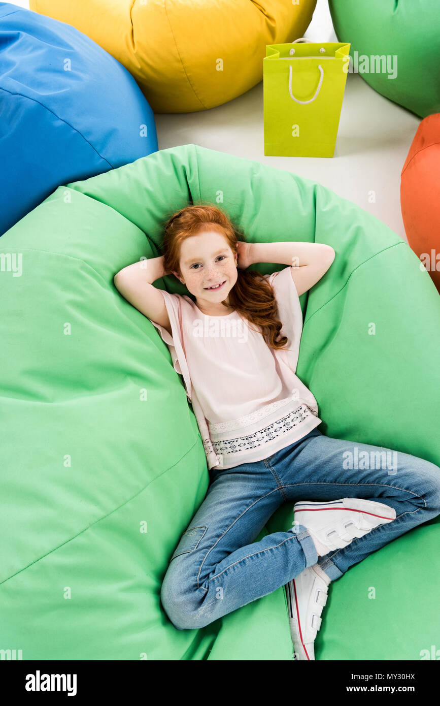 Girl lying on bean bag hi-res stock photography and images - Alamy