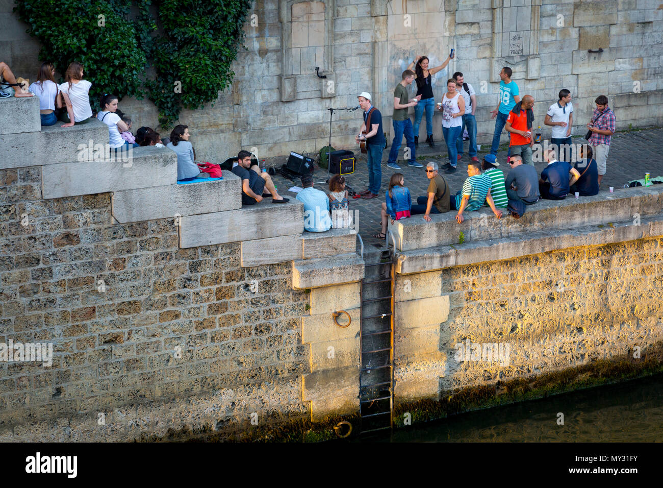 Parisians along River Seine celebrate Fête de la Musique - annual city-wide music festival each June 21st, Paris, France Stock Photo