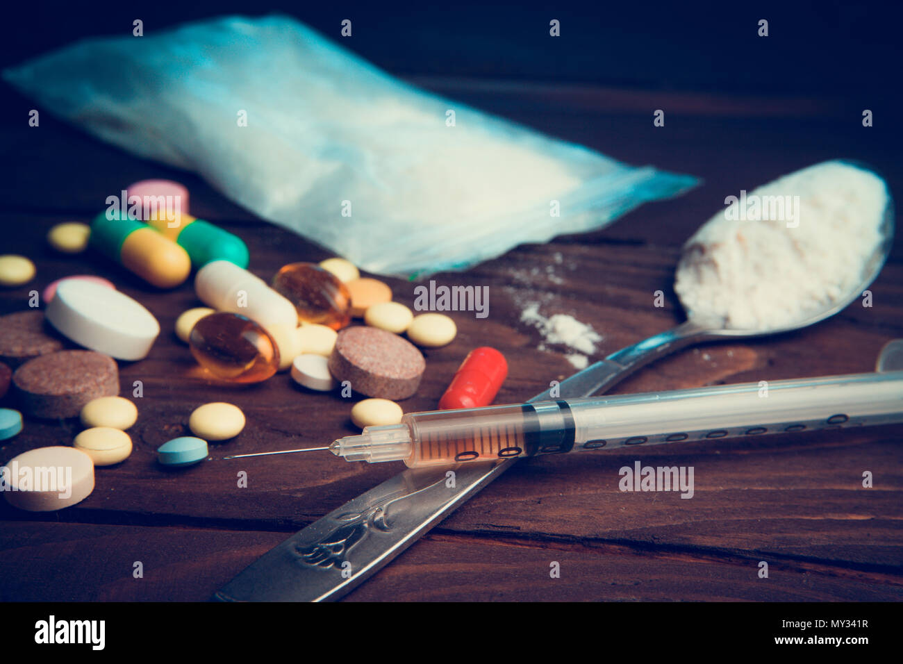 Drug concept. Use illicit Drug abuse .Addiction heroin.Injection, doping. Opium epidemic. Toning, selective focus. Stock Photo