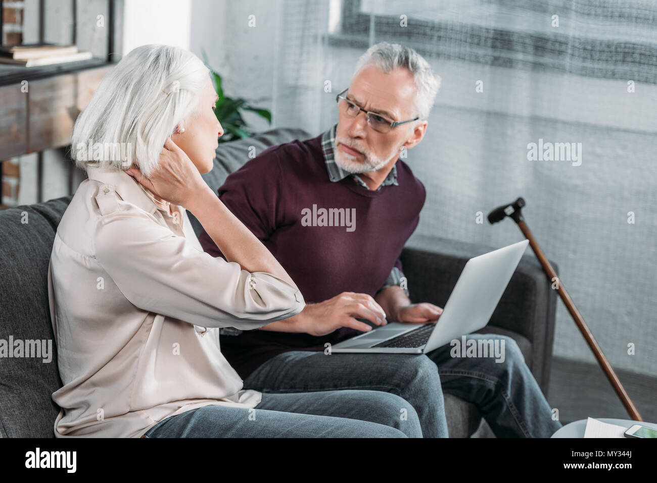 side view of senior woman suffering from strong neck ache Stock Photo ...