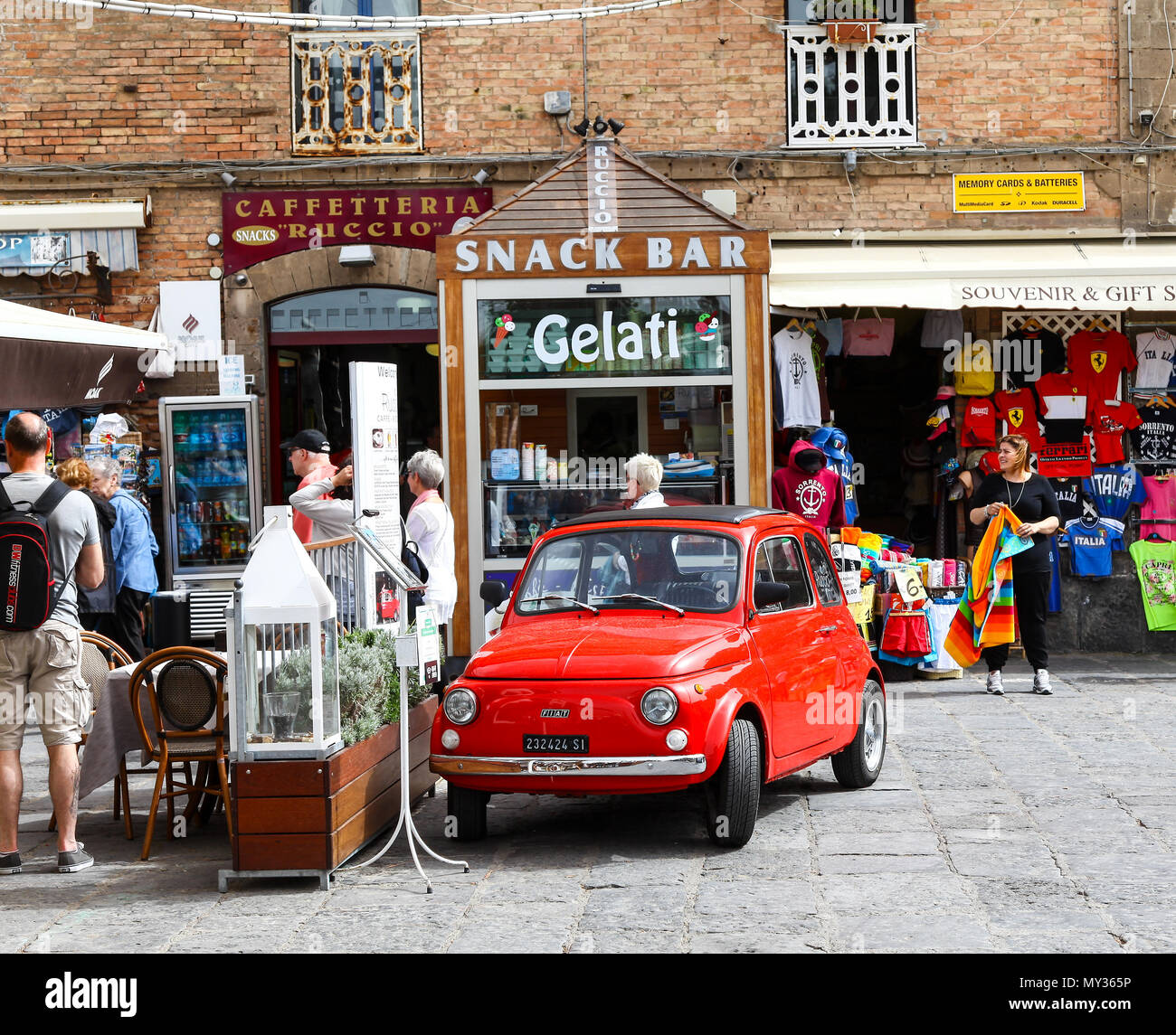 An old red Fiat 500 car advertising the Ruccio Restaurant and Café, Sorrento, Italy Stock Photo