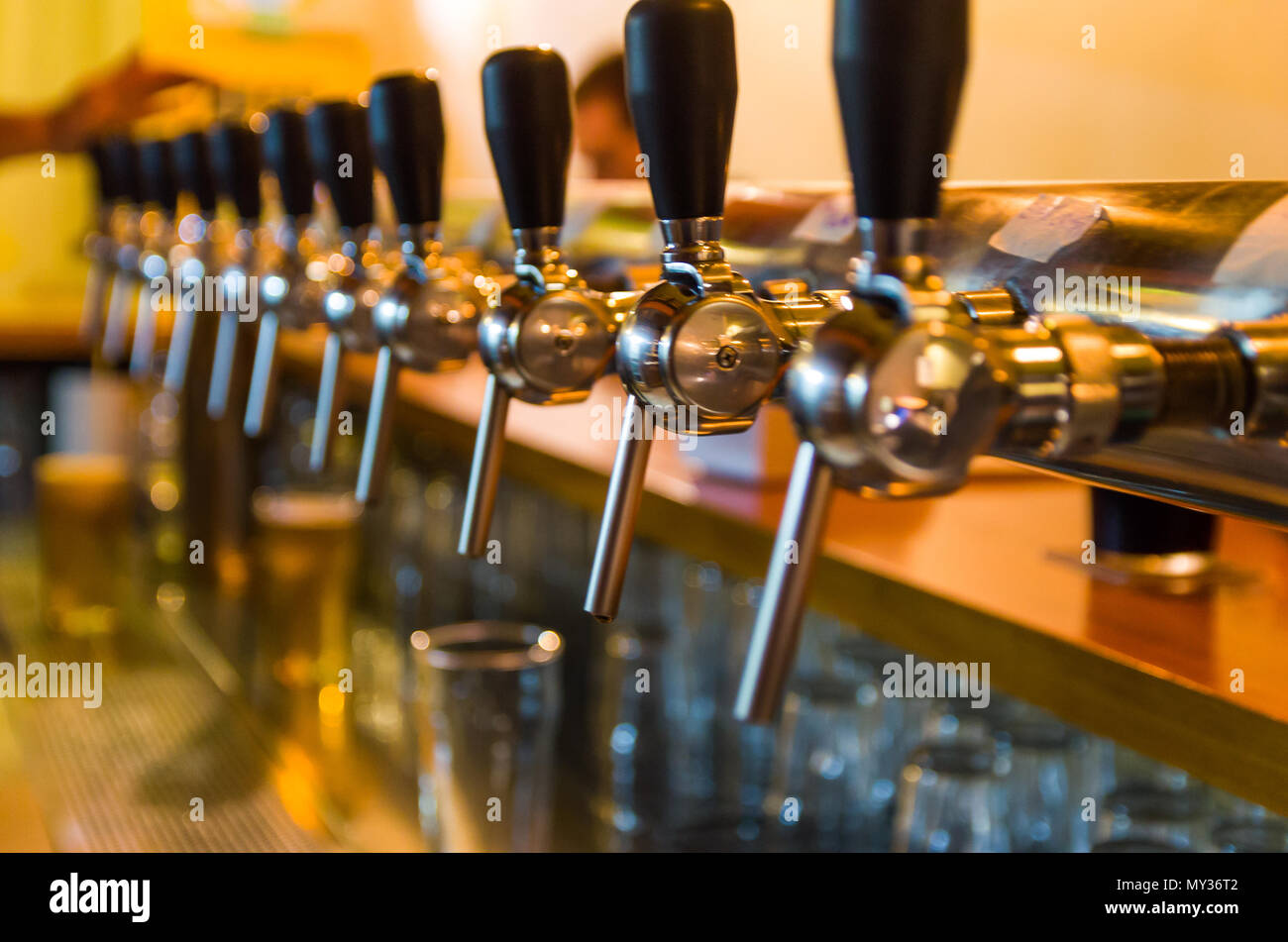 Beer taps on bar counter, brewpub. Craft beer Stock Photo Alamy