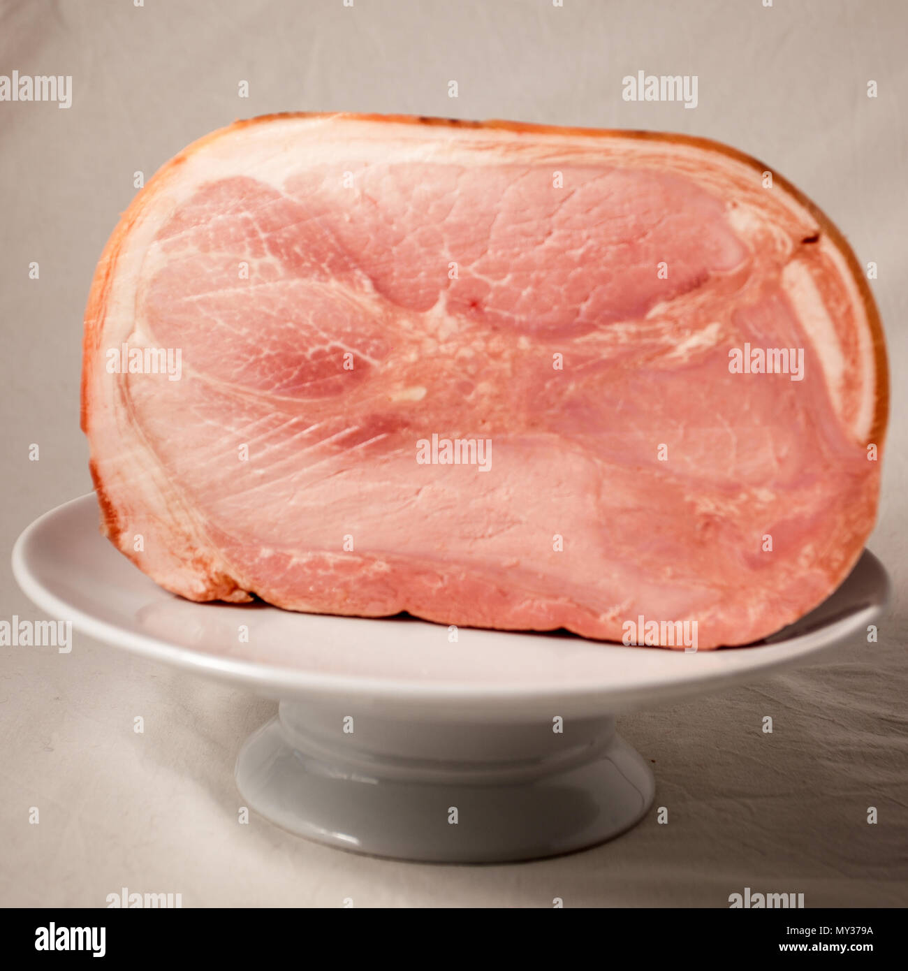 Typical italian cooked ham on a white background in the studio Stock Photo Alamy