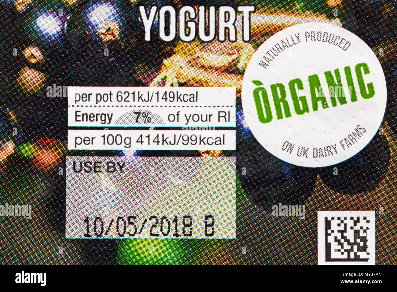 Naturally produced organic on UK dairy farms - detail on pack of Marks & Spencer fruit yogurts blackcurrant Stock Photo