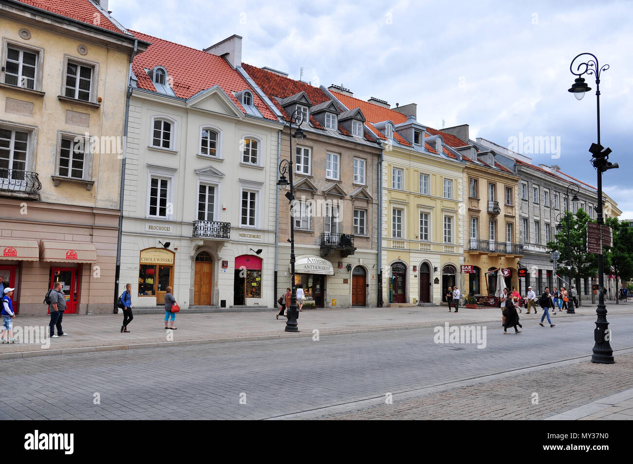 WARSAW, POLAND - JUNE 13: People goes by the shopping street in Warsaw city, Poland on June 13, 2014. Stock Photo