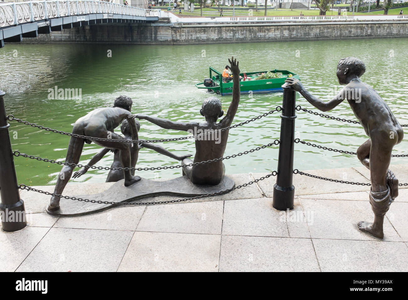 The First Generation sculpture by Chong Far Cheong on the bank of the Singapore River at Fullerton Square also known as the 'Jumping Boys' sculpture Stock Photo