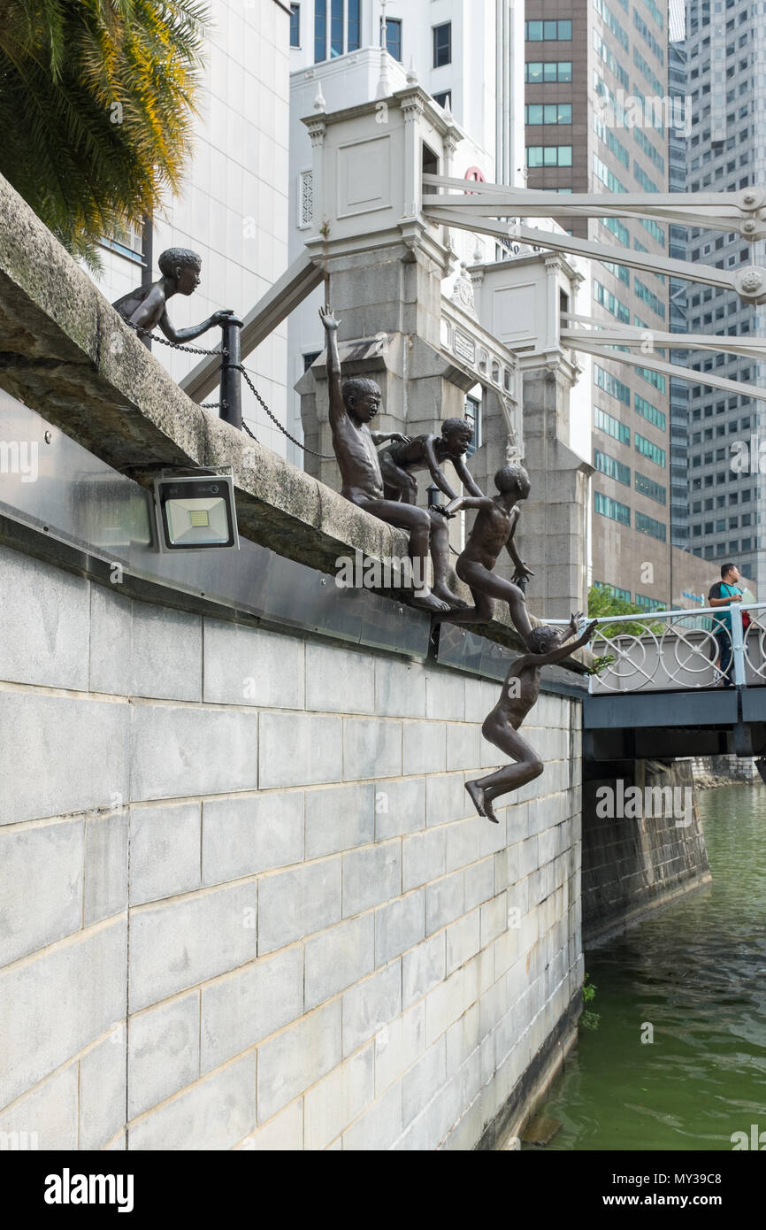The First Generation sculpture by Chong Far Cheong on the bank of the Singapore River at Fullerton Square also known as the 'Jumping Boys' sculpture Stock Photo