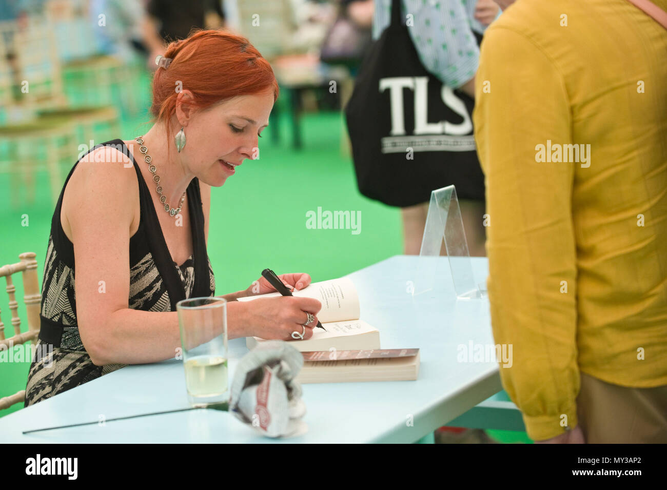 Professor Alice Roberts English anthropologist & television presenter signing books for fans in the bookshop at Hay Festival 2018 Hay-on-Wye Powys Wales UK Stock Photo