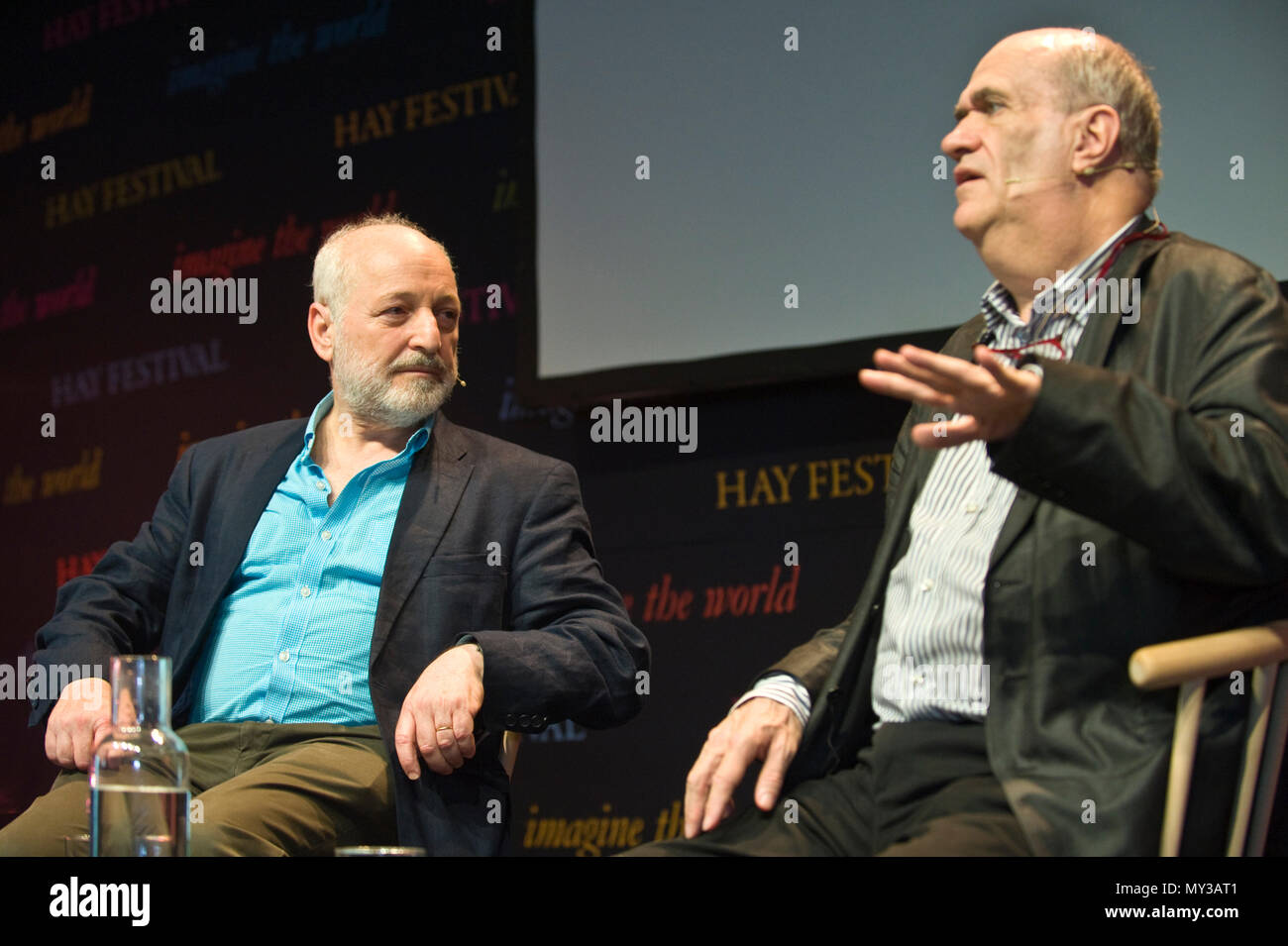 Andre Aciman & Colm Toibin speaking on stage at Hay Festival 2018 Hay-on-Wye Powys Wales UK Stock Photo