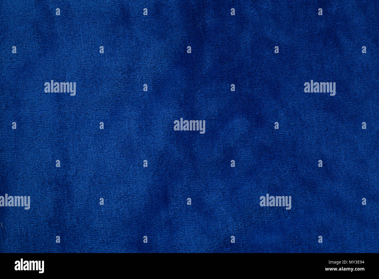 Blue velvet fabric background texture close up Stock Photo - Alamy
