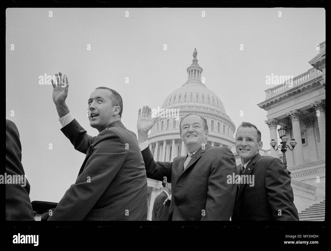 Astronauts James McDivitt (left) and Edward White II (right) ride in a convertible near the U S Capitol with Vice-President Hubert H Humphrey following their successful Gemini IV mission, Washington, DC, 06/17/1965.Photo by Marion S. Trikosko. Stock Photo