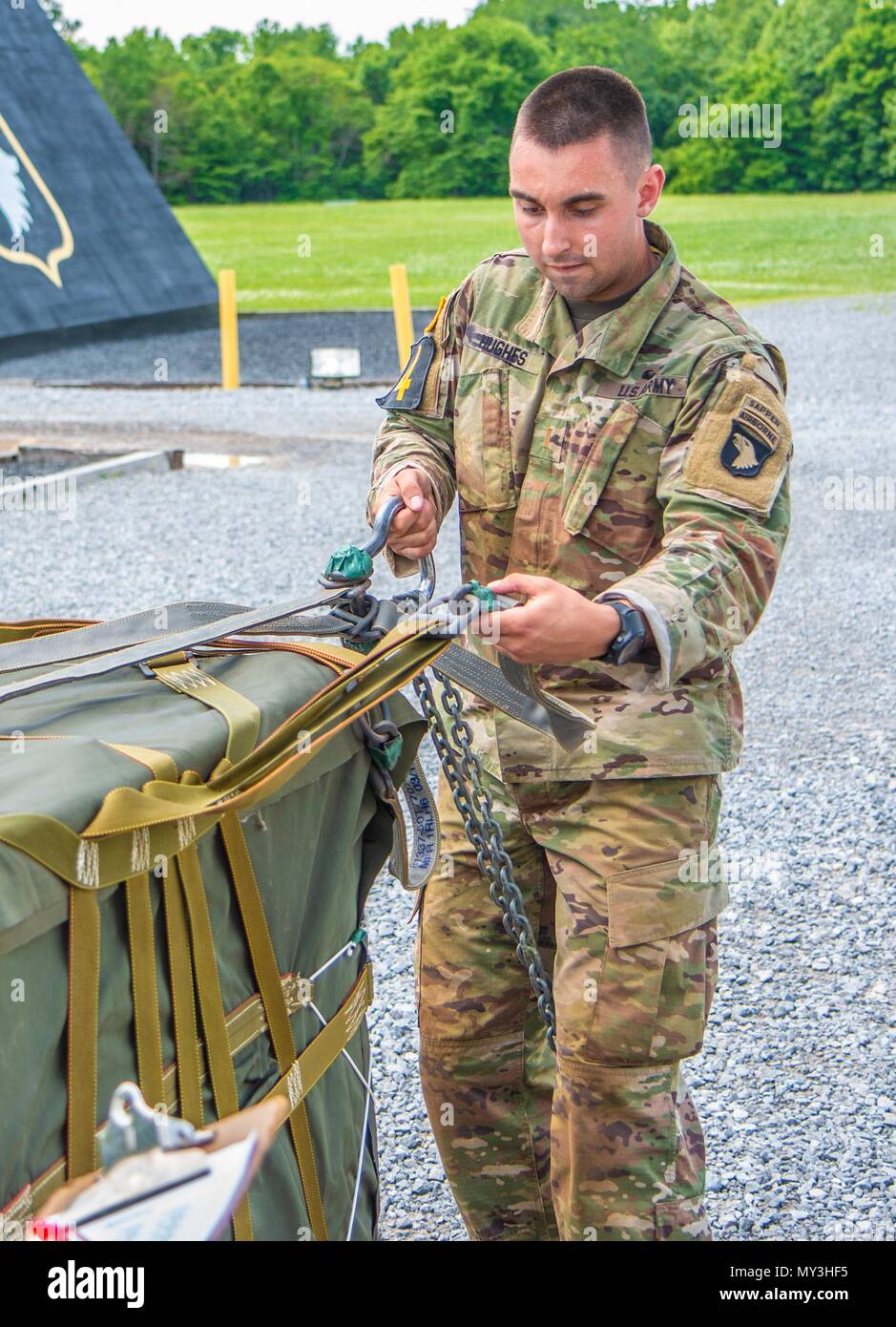 2nd LT, May 24, 2018. Terence Hughes, 39th Brigade Engineer Battalion, 2nd Brigade Combat Team, 101st Airborne Division (Air Assault) inspects the sling load on an A-22 Cargo Bag during the Best Air Assault Competition at The Sabalauski Air Assault School May 24 at Fort Campbell. Air Assault qualified Soldiers of the 101st competed in several events such as a 12 mile road march, a written exam, a buddy run, rappelling, a medical evacuation and trauma lane, obstacle course and sling load inspection. () Stock Photo