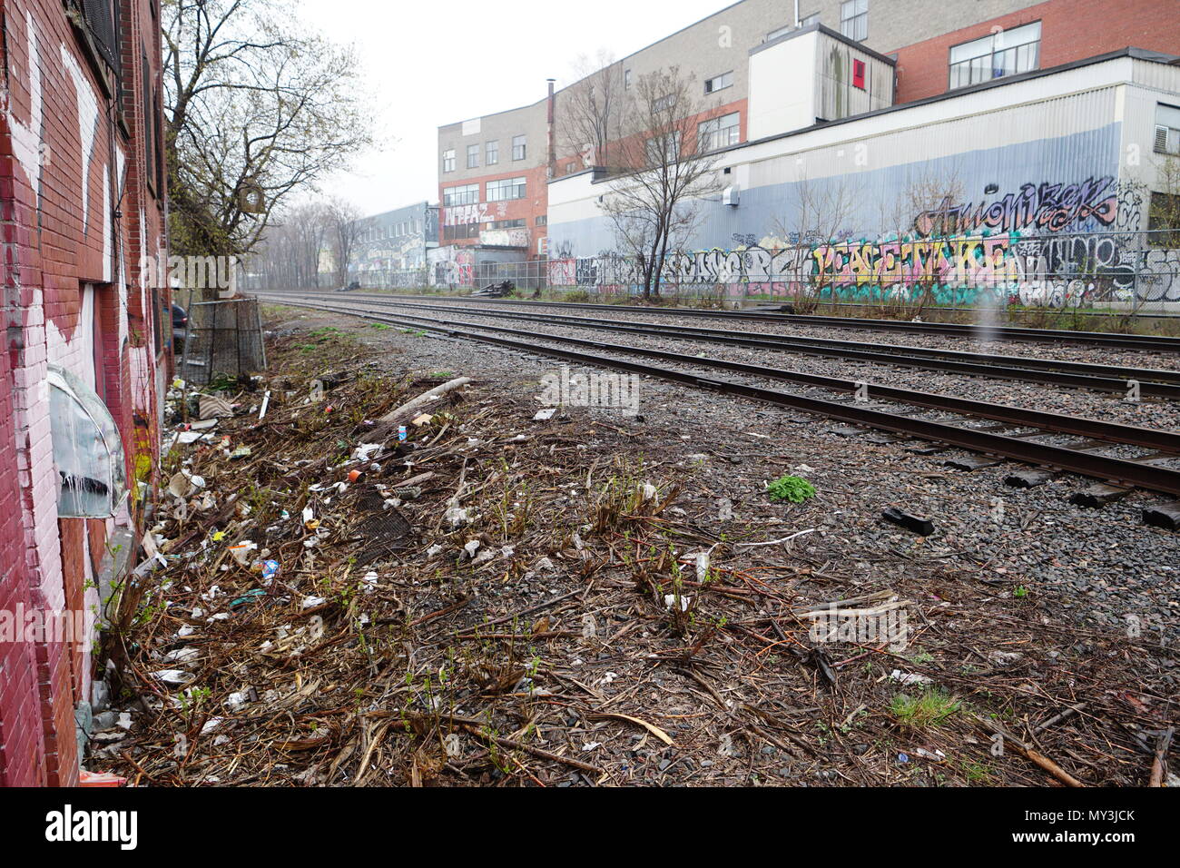 Montreal, QC/Canada -May 27th 2018 :  The Canadian Pacific Railway cross the city of Montreal. Many homeless people open the fence and live along the Stock Photo